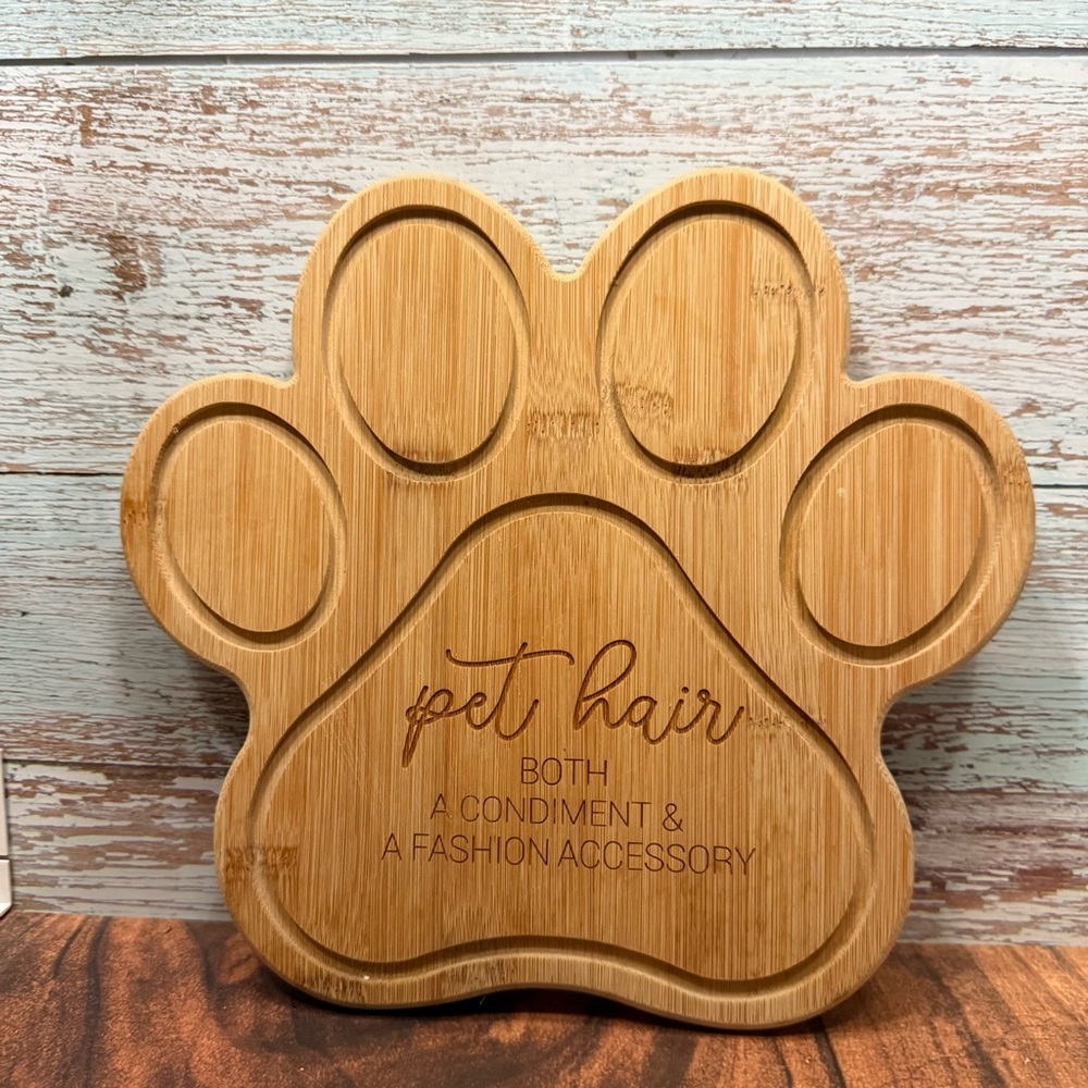 Bamboo cutting board handcrafted shaped like a paw leather hanger